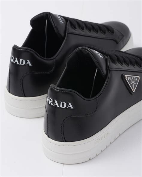 prada black leather sneakers.